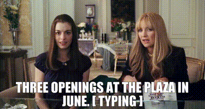 Two women holding hands, listening to the wedding planner say "June openings at the Plaza". Scene from the movie Bride Wars.